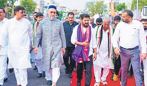 Chief Minister A Revanth Reddy, former MP V Hanumantha Rao and MIM president Asaduddin Owaisi take a walk on the newly inaugurated Moosarambagh Bridge in Hyderabad on Monday.