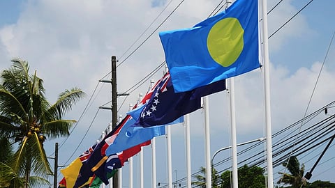 Flags of member states fly outside the summit venue for the Pacific Islands Forum Leaders Meeting in Koror, Palau, Sunday, Aug. 30, 2026.