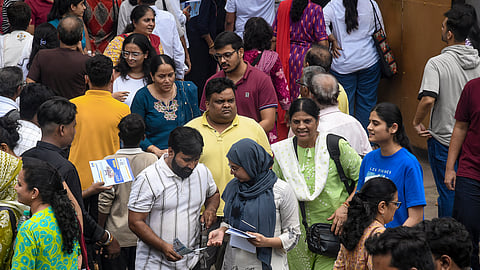 Aspirants leave from an exam centre after appearing in the NEET-PG in Delhi.