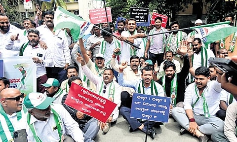 JDS workers protest against Home Minister Priyank Kharge near the KPCC office in Bengaluru on Tuesday