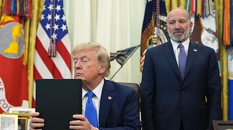 President Donald Trump listens before signing executive orders in the Oval Office of the White House, Thursday, Aug. 6, 2026, in Washington, as Commerce Secretary Howard Lutnick watches.