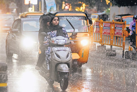 Motorists drive through heavy downpour at Nungambakkam on Thurday evening