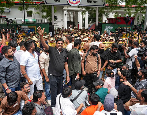 Cockroach Janta Party (CJP) supporters stage a protest outside Parliament Street police station demanding action against self-styled Hindutva influencer Swatantra Bhardwaj over the alleged assault of a student protester's father, in New Delhi, Friday, Sept. 4, 2026. The protest was organised after an interview went viral in which Bhardwaj claimed he assaulted Sanjay Kumar, father of CJP protester Nishu Azad, during a demonstration at Jantar Mantar on July 20th.