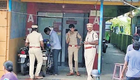 Police inspect the ATM booth at Koodapakkam where the burglary occurred