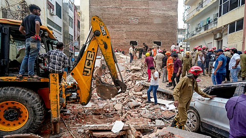 Rescue operation underway after a building collapsed at Satya Niketan area, in New Delhi, Sunday, Sept. 6, 2026.