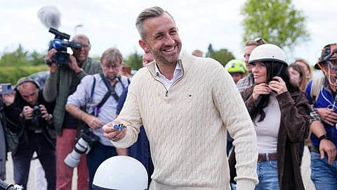 Ulrich Siegmund, top candidate for the "Alternative for Germany" (AfD) party how's his motorcycle keys in party coolers after voting at a polling station during the Saxony-Anhalt state elections in Tangermuende, eastern Germany, Sunday, Sept. 6, 2026.