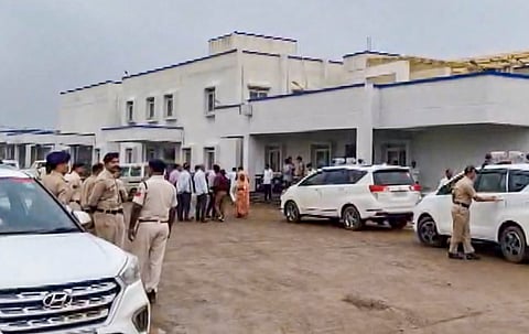 Police personnel conduct an investigation as they arrive at a hospital after six persons died, and as many as five others fell ill following alleged consumption of spurious liquor, in Sagar district, Madhya Pradesh, Sunday, Sept. 6, 2026.