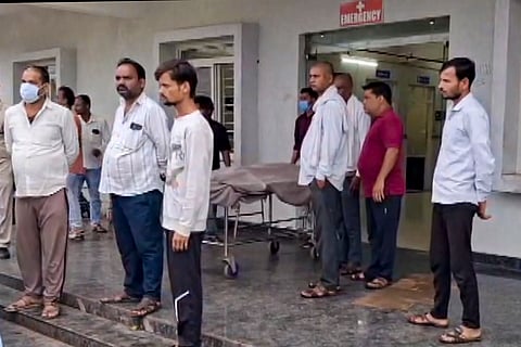 People gather at a hospital after six persons died, and as many as five others fell ill following alleged consumption of spurious liquor, in Sagar district, Madhya Pradesh, Sunday, Sept. 6, 2026.