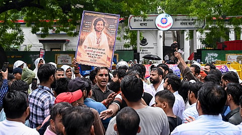 Supporters of Hindutva influencer Swatantra Bhardwaj stage a protest outside Parliament Street police station following his detention over the alleged assault of Sanjay Kumar, father of CJP protester Nishu Azad, in New Delhi, Saturday, Sept. 5, 2026.