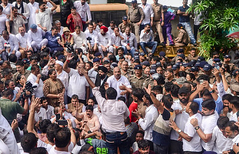 Police stop Congress leaders during a protest march towards the Uttarakhand CM's residence over an FIR filed against Lok Sabha LoP Rahul Gandhi in Haldwani over the 'purification' row, in Dehradun, Monday, Sept. 7, 2026.