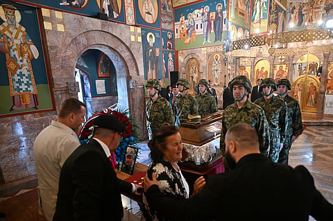 Mourners stand past the coffin of late Bosnian Serb military leader Ratko Mladic while taking part in a public memorial on the day of his funeral ceremony at St Lukas church in Belgrade, on September 7, 2026.