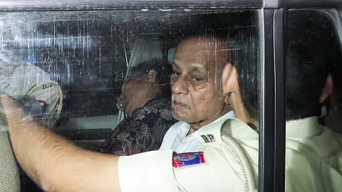 Delhi Police brings the arrested accused, Hariram, his wife Urmila, and their son Mahesh to RK Puram Police Station in connection with the Satya Niketan building collapse case, in New Delhi on Monday. Seven people lost their lives in the incident.