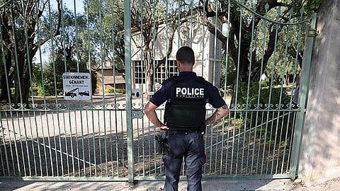 A police officer stands in front of the entrance of the Musee Renoir after four paintings, together valued at nine million euros, were stolen in an early-morning break-in, with two recovered in the museum's garden and two still missing, in Cagnes-sur-Mer on September 8, 2026.