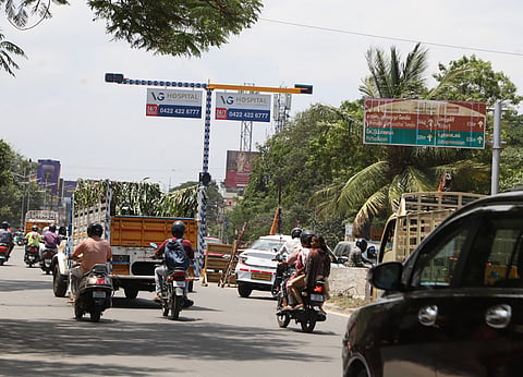 Despite the Coimbatore District Collector's order, advertisement hoardings installed near traffic signals are yet to be remove