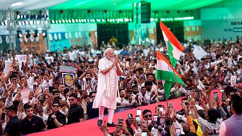 Prime Minister Narendra Modi waves to the gathering during the 'NaMo for Viksit Bharat' event, in Vadodara, Gujarat, Sept. 8, 2026.