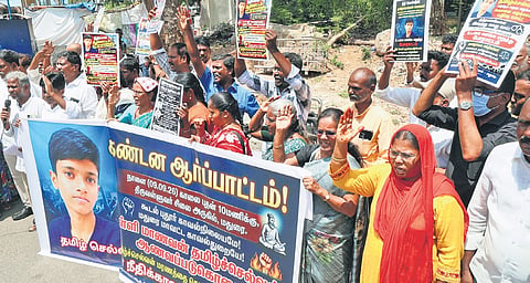 K Tamilselvan’s family members staging a protest on Wednesday