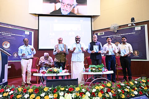 Transport Minister C P John, State Planning Board vice-chairman K M Chandrasekhar and other dignitaries at the inaugural function of the national conference organised by GIFT