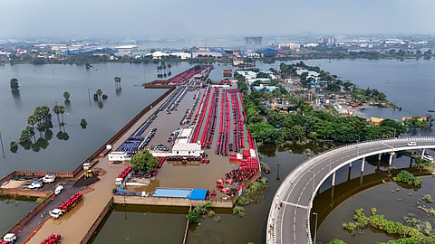An aerial view shows tractors partially submerged in floodwaters at a dealership stockyard following a rise in the water level of the Punpun River, in Patna, Bihar, Wednesday, Sept. 9, 2026.