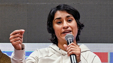 Wrestler and Congress MLA Vinesh Phogat addresses a press conference at the DPCC office in New Delhi.