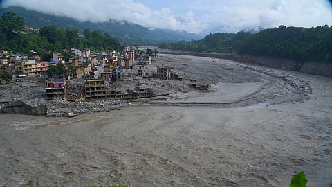 Houses damaged by flash floods are seen on the bank of the Trishuli River in Dhunge, Nuwakot district, Nepal, Monday, Sept. 7, 2026.