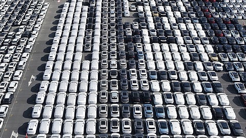 Aerial view of new cars waiting for shipment at a port in Shanghai, China, on Jan. 14, 2026.