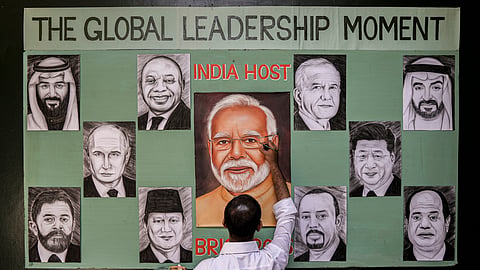 An artist gives final touches to portraits of the BRICS member countries' leaders, ahead of the 18th edition of the summit, in Amritsar, Punjab, Thursday, Sept. 10, 2026.