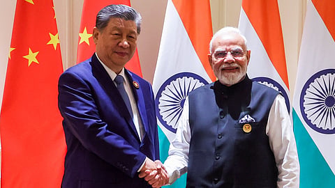 Prime Minister Narendra Modi and Chinese President Xi Jinping exchange a handshake during the 18th BRICS Summit 2026 at Bharat Mandapam, in New Delhi on Saturday.