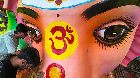 People offer prayers to Khairatabad Bada Ganesh in Hyderabad on Saturday.