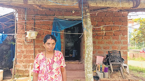 Geeta who is waiting for title deed outside her unplastered house