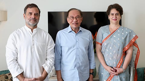 From left, Leader of Opposition in the Lok Sabha Rahul Gandhi, Malaysia's Prime Minister Anwar Ibrahim, Congress Leader Priyanka Gandhi Vadra pose for photographs during a breakfast meeting, in New Delhi.