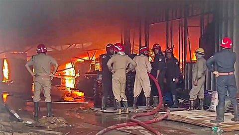Firefighters at the site after a fire broke out at a godown storing wooden items in east Delhi's Dallupura area, Sunday, Sept. 13, 2026.