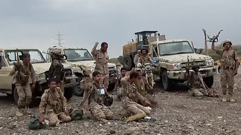 This image taken from undated video released by the Ansar Allah Media Office, the media arm of Yemen's Houthi rebels, on Saturday, Sept. 12, 2026, shows Houthi fighters chant after praying beside military vehicles during what the group says was their advance against Saudi-backed forces at an undisclosed location in southern Yemen.