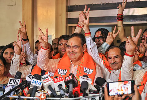 Chief Minister Bhajan Lal Sharma and BJP State President Madan Rathore, along with party leaders, flash victory signs following the ruling party's performance in the Rajasthan Urban Local Body elections, at the BJP headquarters in Jaipur, Monday, Sept. 14, 2026.