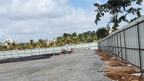 Gravel is also being laid and compacted at some locations, while workers are engaged in site preparation and other construction activities.