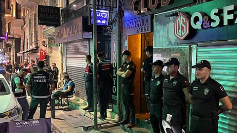 This handout photograph, taken and released on September 13, 2026, by Turkish news agency DHA (Demiroren News Agency), shows Turkish police standing outside a night club during a Police raid as part of the "My family is safe" operation in Istanbul.