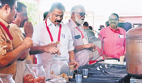CPM state secretary M V Govindan having refreshments from a tea stall set up near the venue of the extended state committee meet in Kozhikode