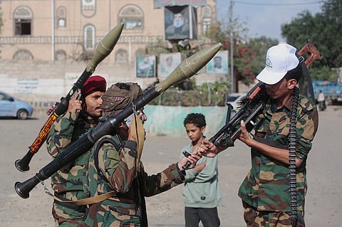 Yemen's Houthi rebels chat as they check their weapons during a mobilization campaign in Sanaa, Yemen, Thursday, Sept. 10, 2026.