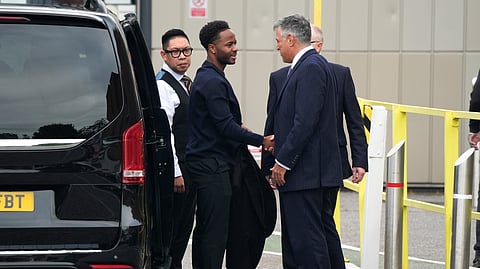 Former England soccer player Raheem Sterling, second left, arrives at Basingstoke Magistrates' Court ahead of his first appearance accused of dangerous driving in Hampshire, England, Tuesday, Sept. 15, 2026.