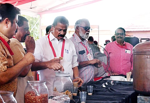 CPM state secretary M V Govindan having refreshments from a tea stall set up near the venue of the extended state committee meet in Kozhikode