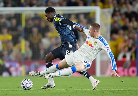 Newcastle United's Aladji Bamba, left, and Leeds United's Sean Longstaff battle for the ball during the English Premier League soccer match between Leeds United and Newcastle United in Leeds, England, Monday, Sept. 14, 2026.