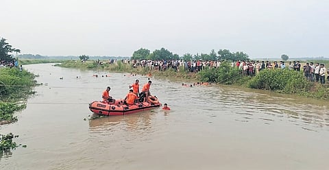 Rescue operation underway in Brudhha river in Erasama on Wednesday.
