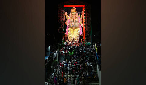 Devotees gather for darshan of the 72-foot clay Lord Ganesha idol during Ganesh Navaratri celebrations at Nagole in Hyderabad.