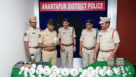 Anantapur SP P. Jagadish displays the silver ornaments and melted silver recovered from the three-member interstate temple theft gang at a press conference in Anantapur on Tuesday.