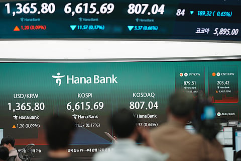 The screens showing the foreign exchange rates are displayed at a dealing room of Hana Bank in Seoul, South Korea, Wednesday, Sept. 16, 2026.