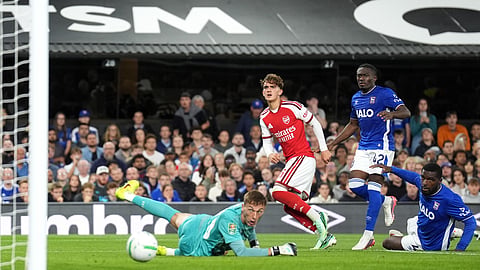 Arsenal's Max Dowman, centre, scores their side's third goal during the League Cup third round soccer match between Ipswich Town and Arsenal in Ipswich, England, Tuesday, Sept. 15, 2026.
