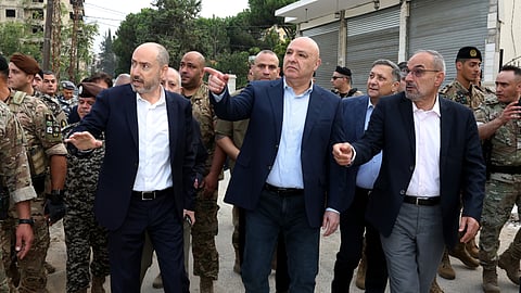 In this photo released by the Lebanese Presidency press office, Lebanese President Joseph Aoun, center, gestures during a visit near the site where Israel captured a strategic hill earlier this month, in the city of Nabatiyeh, southern Lebanon, Saturday, Sept. 12, 2026.