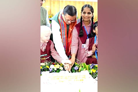 Uttarakhand Chief Minister Pushkar Singh Dhami cut his birthday cake with the children at the National Institute for the Empowerment of Persons with Visual Disabilities (NIEPVD) in Dehradun.