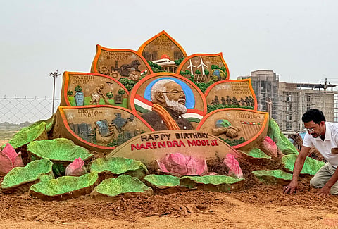 A sand artist creates a sand art to commemorate Prime Minister Narendra Modi's 76th birthday, at Pushkar, in Ajmer district, Rajasthan, Thursday, Sept. 17, 2026.