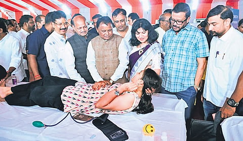 Chief Minister Mohan Charan Majhi with ministers and party leaders interacts with a woman donor at the mega blood donation camp, held at Exhibition Ground in Bhubaneswar on Thursday.