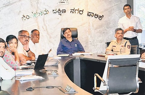 South City Commissioner K N Ramesh chairs a meeting with Traffic Police and Bescom officials on Thursday.